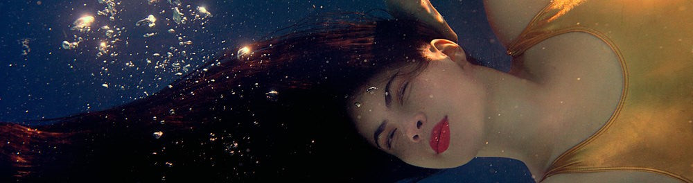 woman underwater with flowing hair