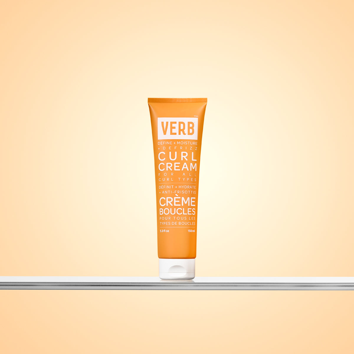 Tube of Verb Curl Cream on a gradient orange background